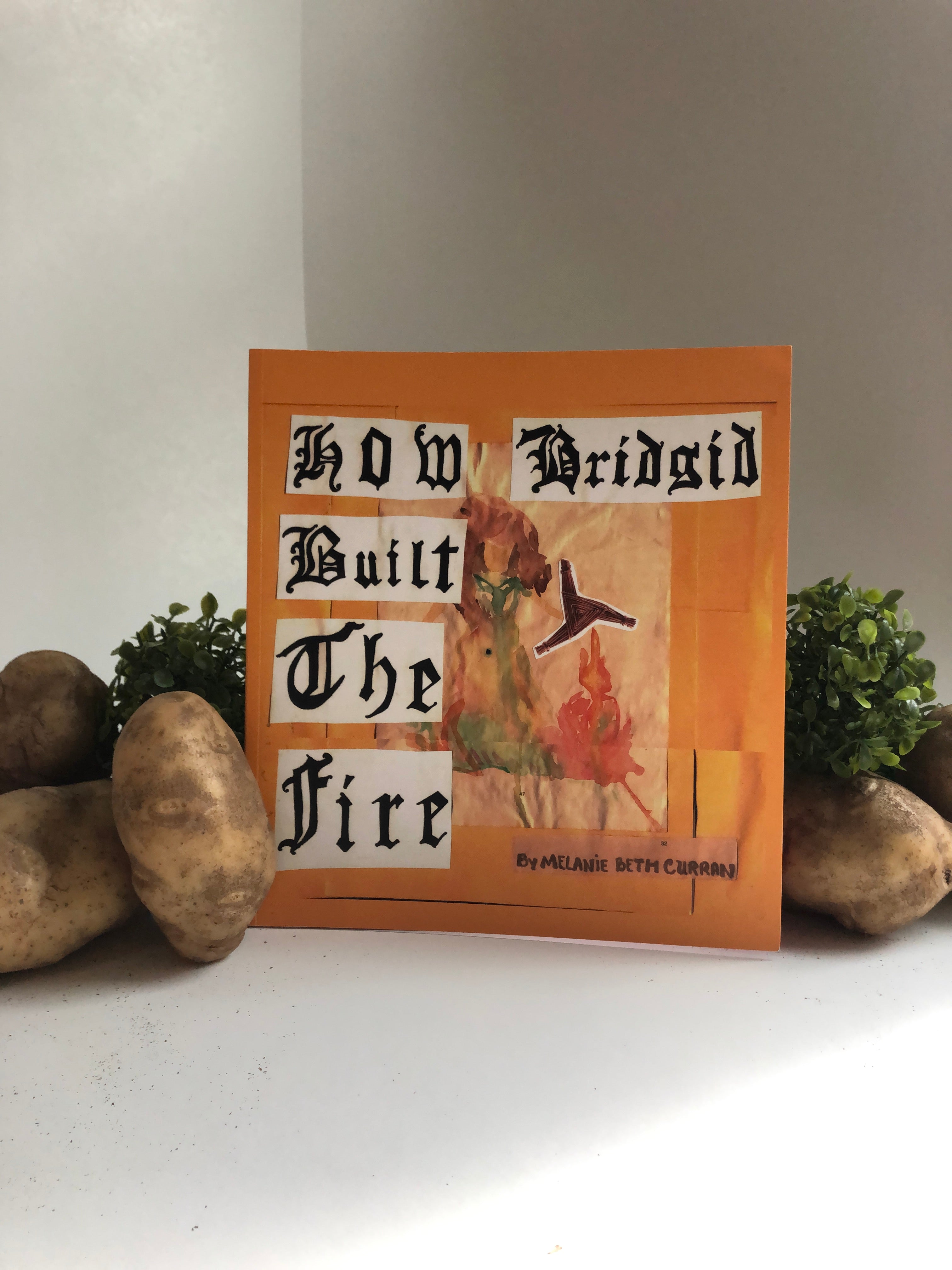 Handmade book with text and graphics on a white background about Brigid